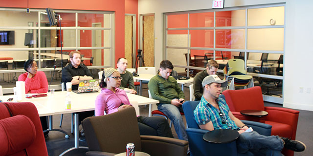 Group watching presentation by Clarissa Peterson.